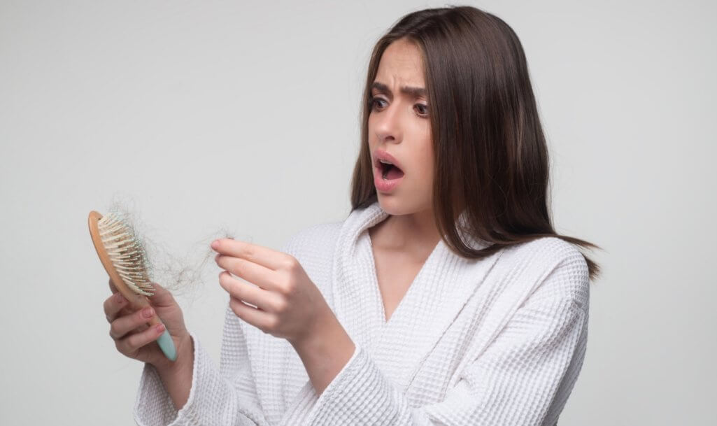 Young woman is very upset because of hair loss. Haircut and healthy haircare. Serious hair loss problem for health care shampoo. (1)